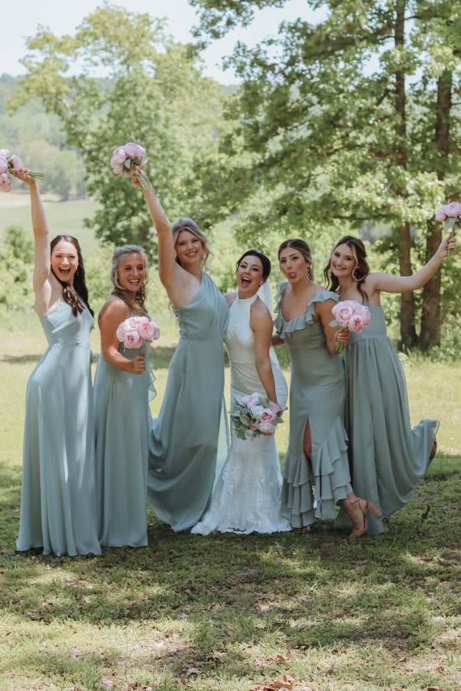bride and bridesmaids in sage green dresses