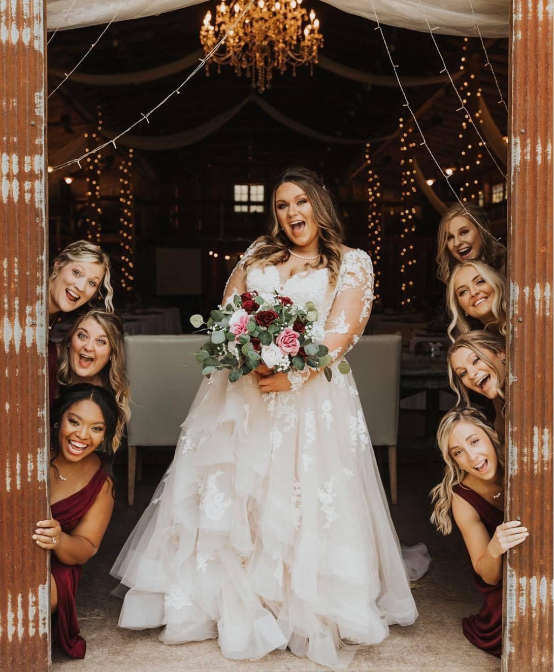 bride smiling with bridesmaids
